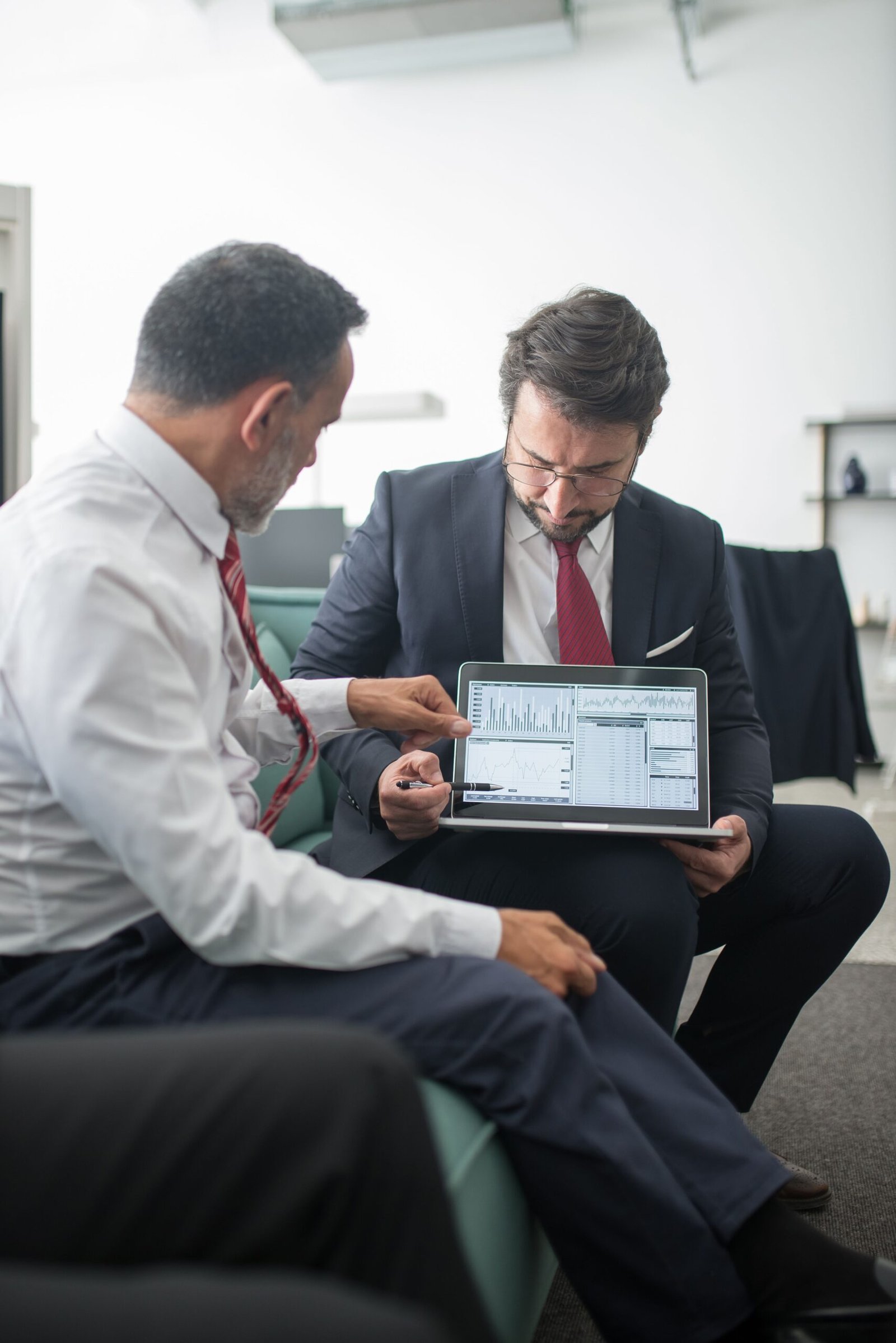 Two Colleagues reviewing laptop