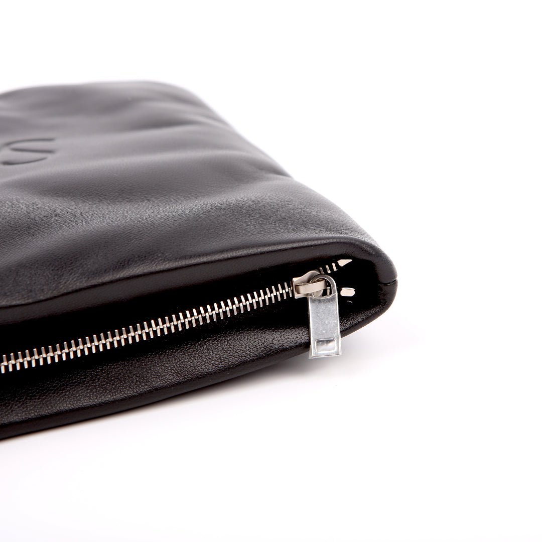 Saint Laurent Large Puffy Pouch in black lambskin, silver-tone zip pull detail